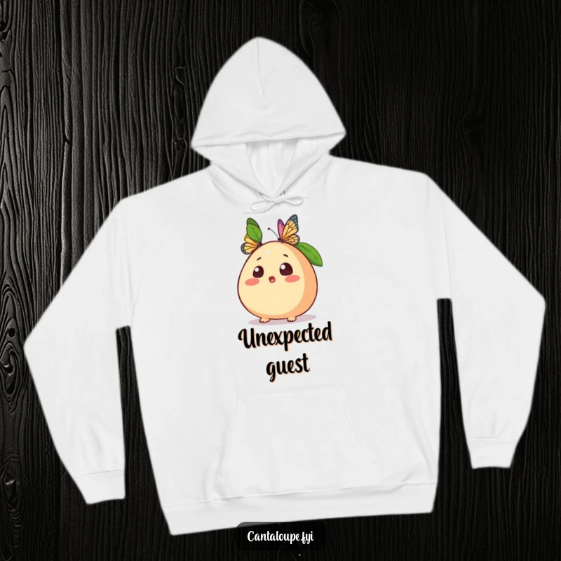 Funny hoodie depicting a cantaloupe character looking shocked as a butterfly lands on it, designed for warmth and amusement.